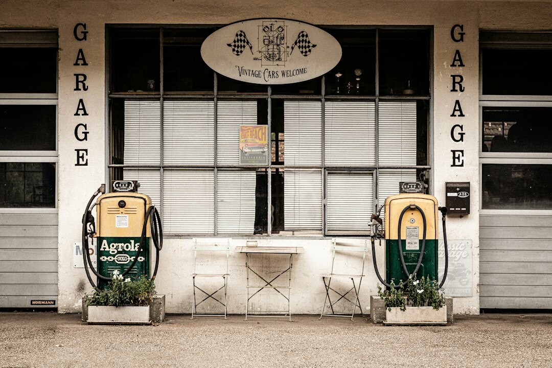 Historic stone garage in Colonia del Sacramento filled with old automobiles
