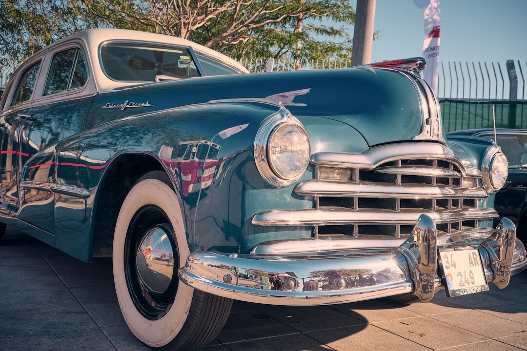 Restored 1950s classic automobile displayed in a studio setting